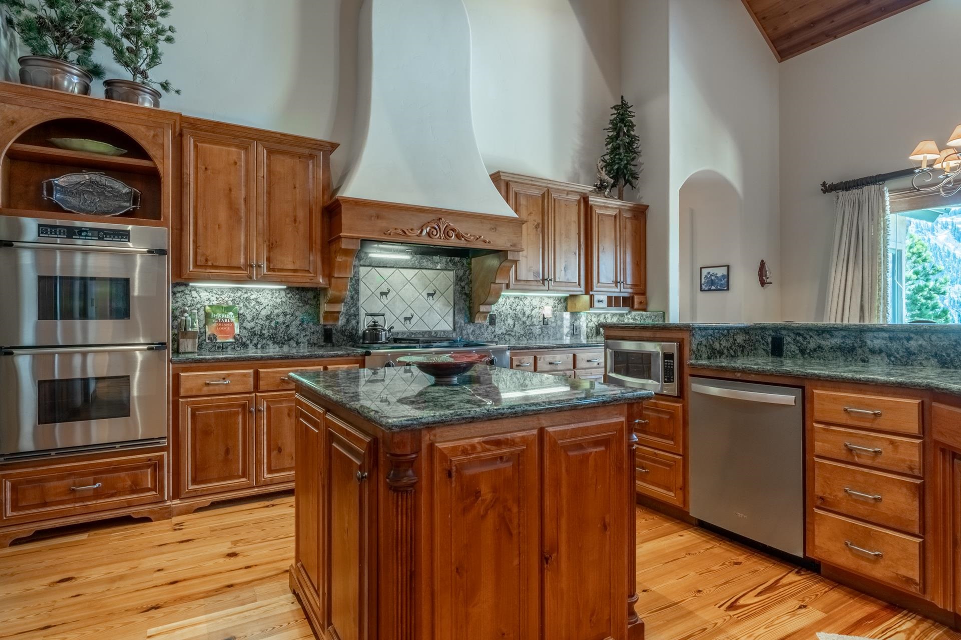 45 Skyline Road June Lake, CA 93529 - Photo 10 of 58 a kitchen with stainless steel appliances granite countertop a sink and wooden cabinets