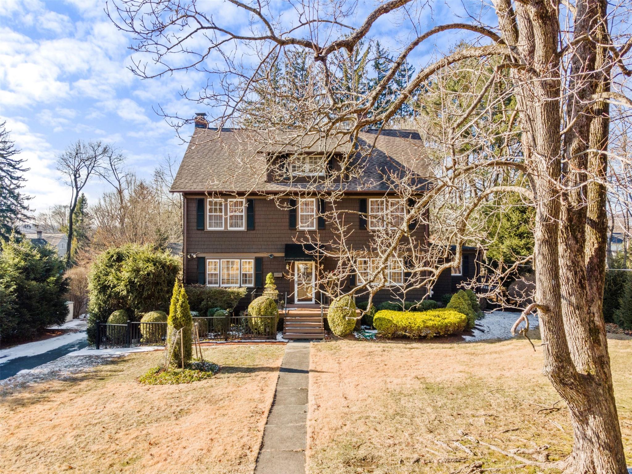 22 Willetts Road Mount Kisco, NY 10549 - Photo 1 of 1 View of front facade featuring a front lawn