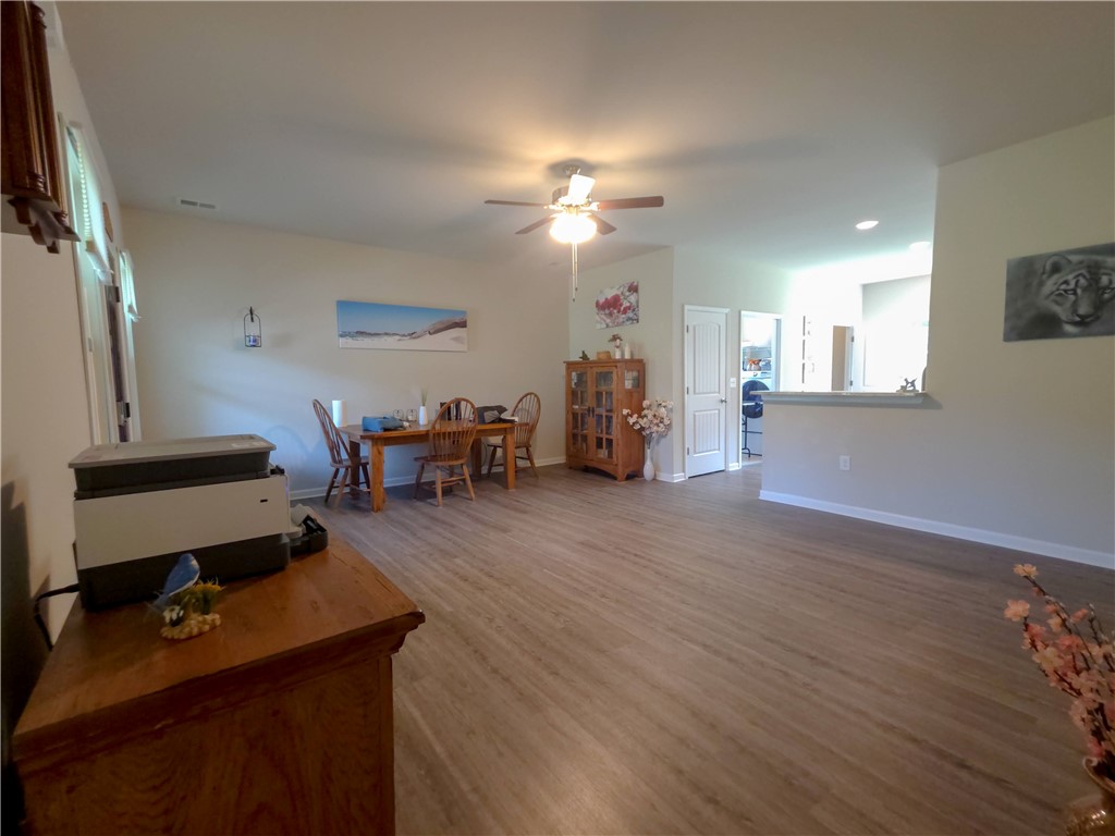 3 Cringle Lane Anderson, SC 29625 - Photo 2 of 26 An inviting open-concept living and dining area features durable flooring and warm lighting, perfect for entertaining.