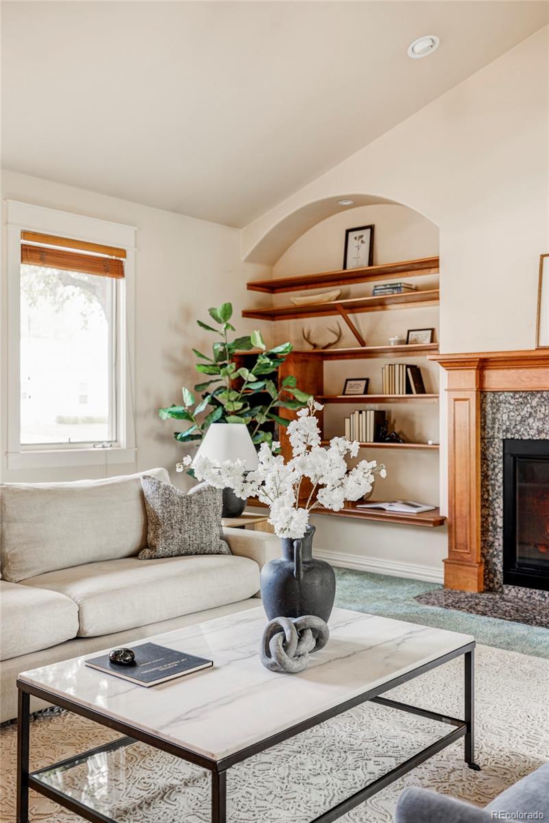 701 Leyden Street Denver, CO 80220 - Photo 11 of 42 a living room with furniture and a fireplace