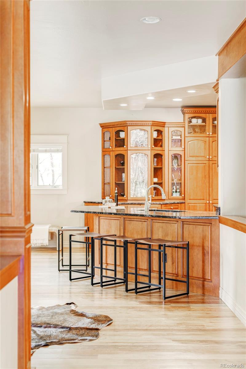 701 Leyden Street Denver, CO 80220 - Photo 14 of 42 a living room with wooden floor and glass windows