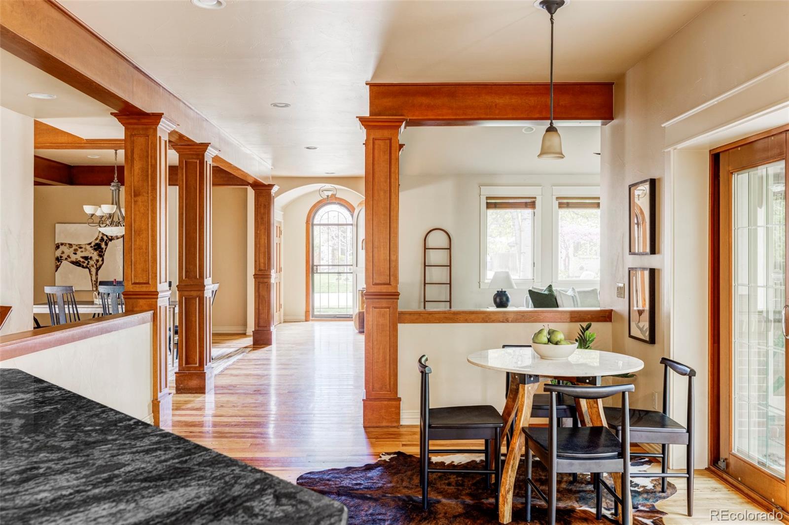 701 Leyden Street Denver, CO 80220 - Photo 18 of 42 a view of a a dining room with furniture window and wooden floor