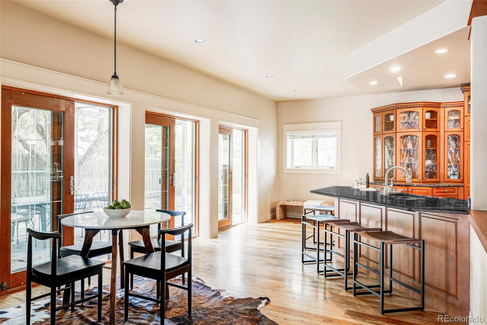 701 Leyden Street Denver, CO 80220 - Photo 19 of 42 a dining room with furniture window wooden floor