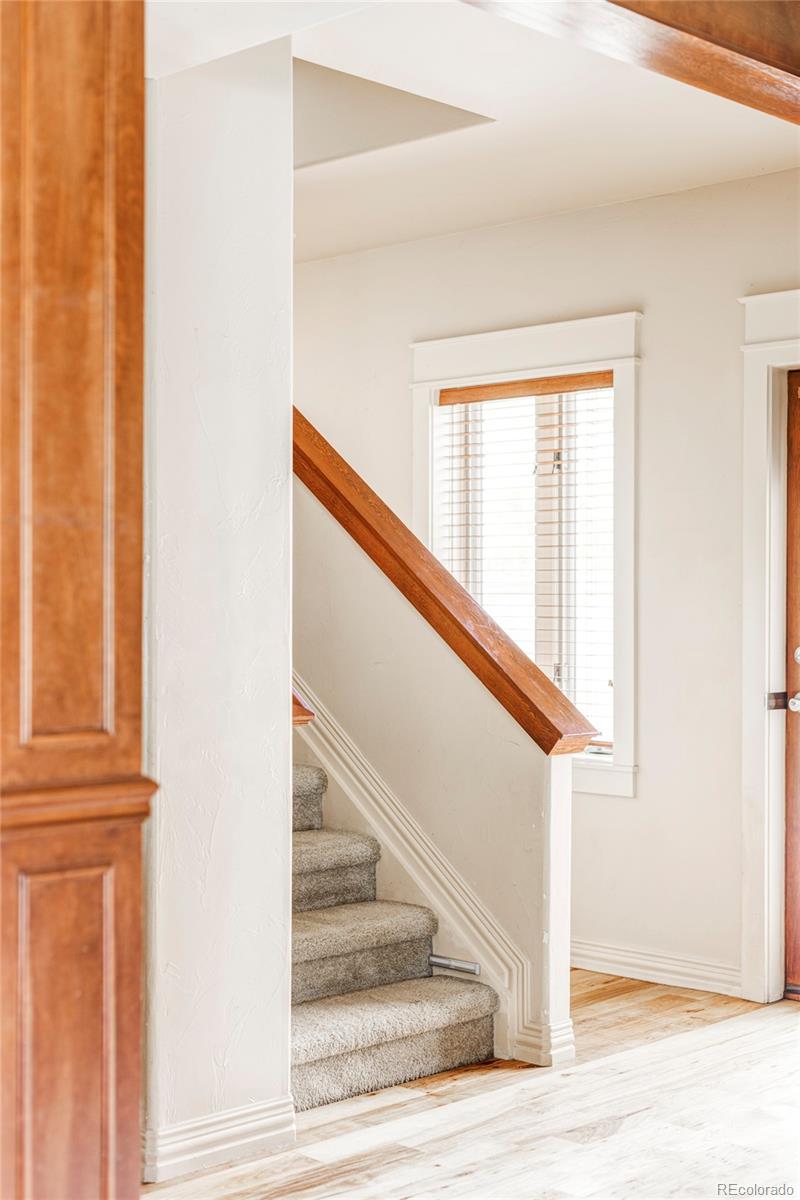 701 Leyden Street Denver, CO 80220 - Photo 25 of 42 a view of staircase with white walls and a window