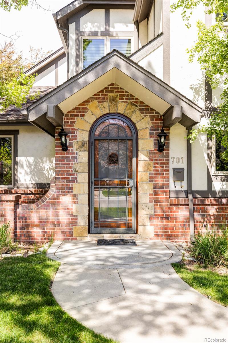 701 Leyden Street Denver, CO 80220 - Photo 3 of 42 a front view of a house with a garden