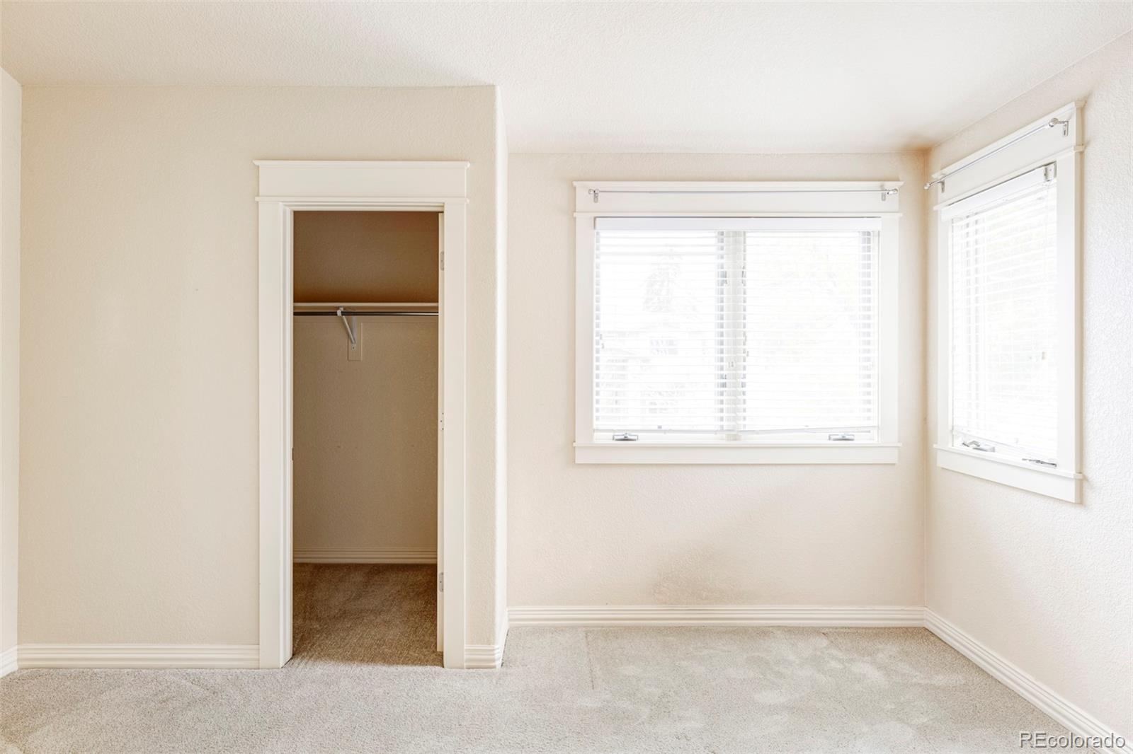 701 Leyden Street Denver, CO 80220 - Photo 32 of 42 an empty room with windows and closet