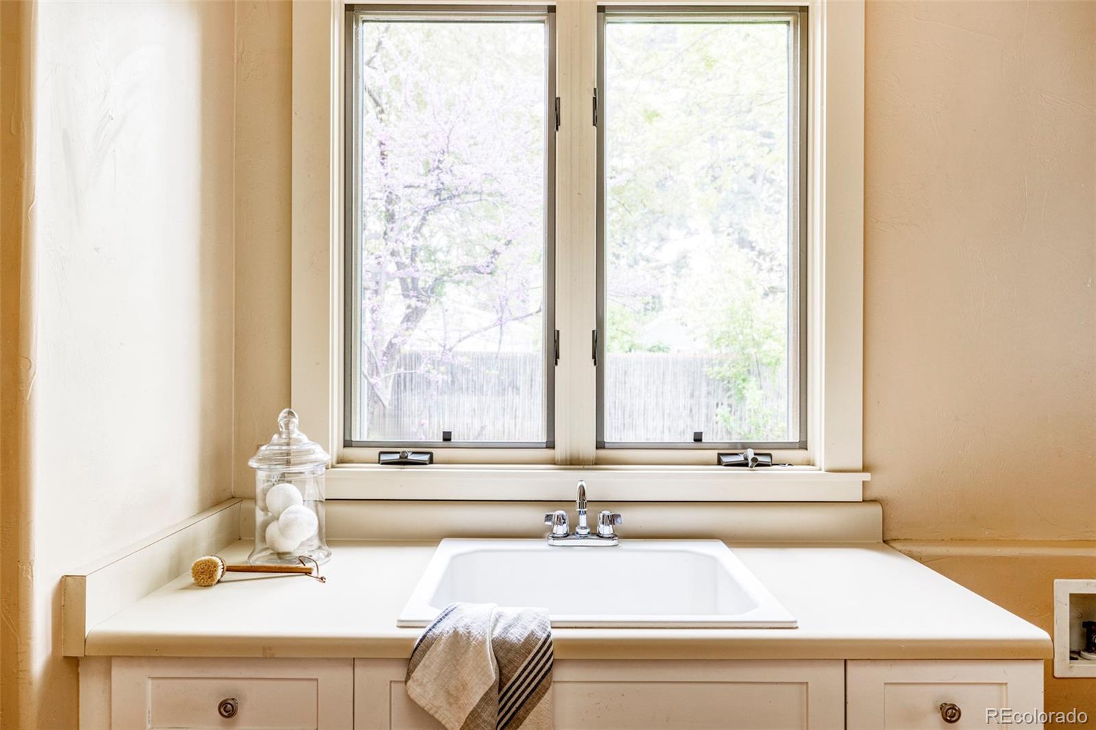701 Leyden Street Denver, CO 80220 - Photo 38 of 42 a bathroom with a sink and a mirror