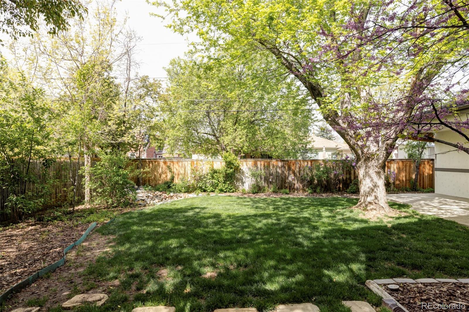 701 Leyden Street Denver, CO 80220 - Photo 41 of 42 a big yard with lots of green space and trees