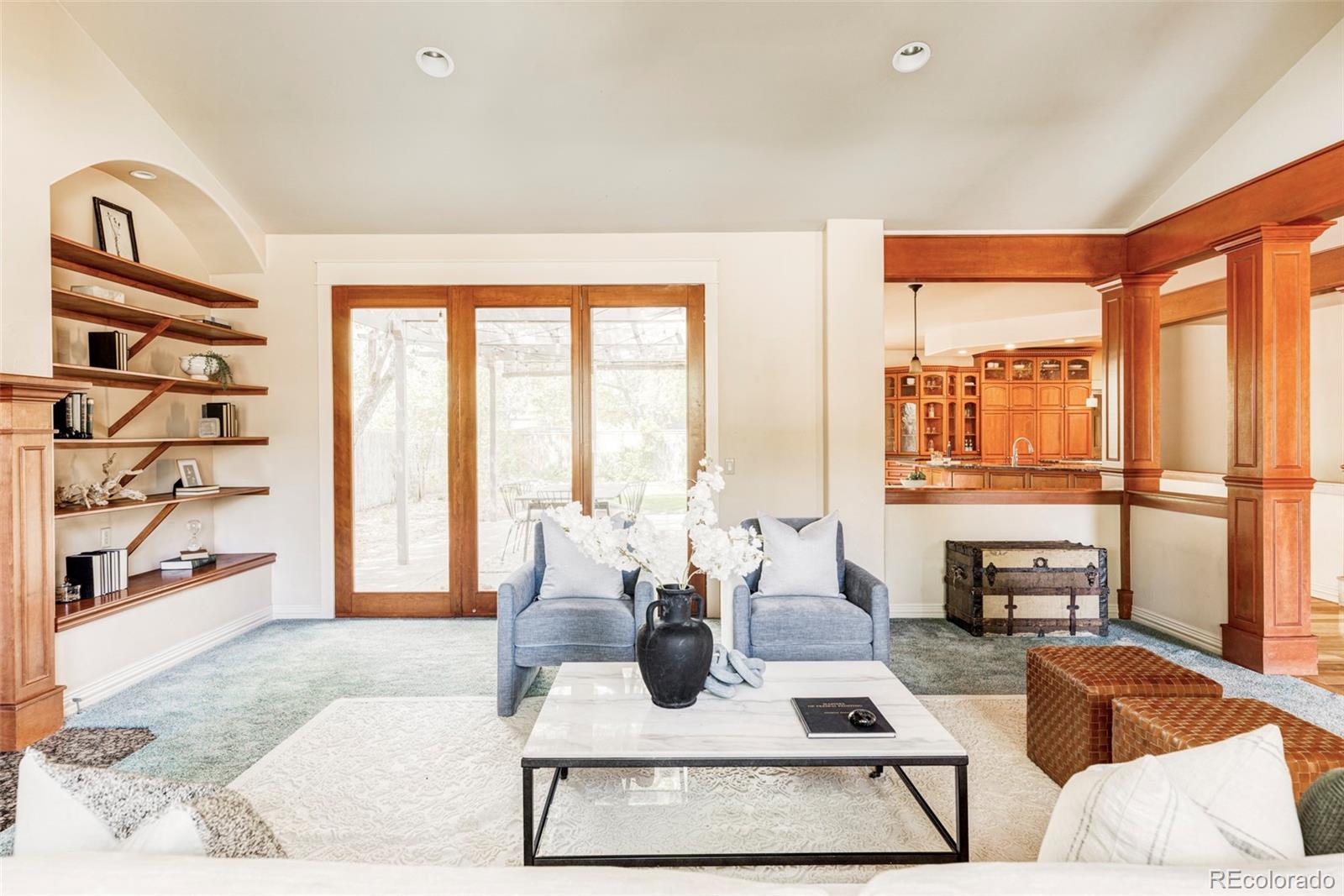 701 Leyden Street Denver, CO 80220 - Photo 10 of 42 a living room with furniture large windows and wooden floor