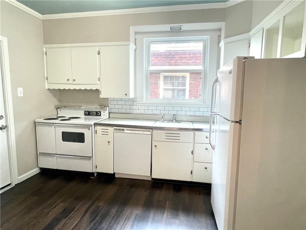315 Spruce Street Butler, PA 16001 - Photo 13 of 38 a kitchen with cabinets appliances a sink and a window