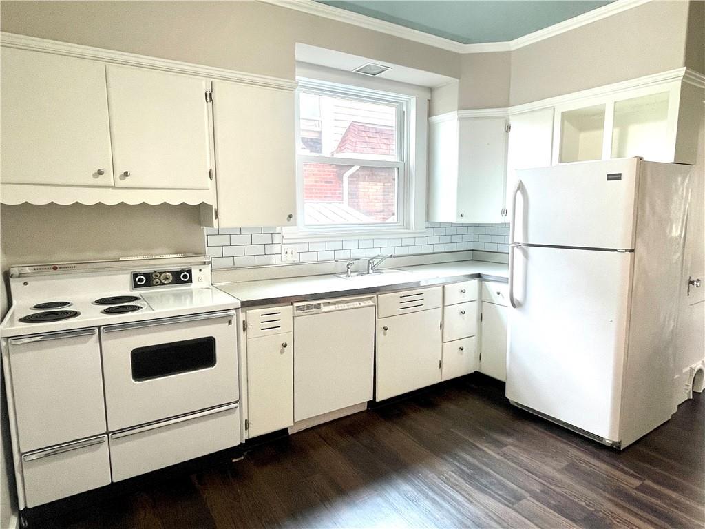 315 Spruce Street Butler, PA 16001 - Photo 14 of 38 a kitchen with cabinets appliances a sink and a window