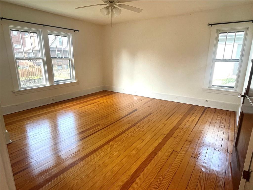 315 Spruce Street Butler, PA 16001 - Photo 21 of 38 a view of an empty room with wooden floor and a window