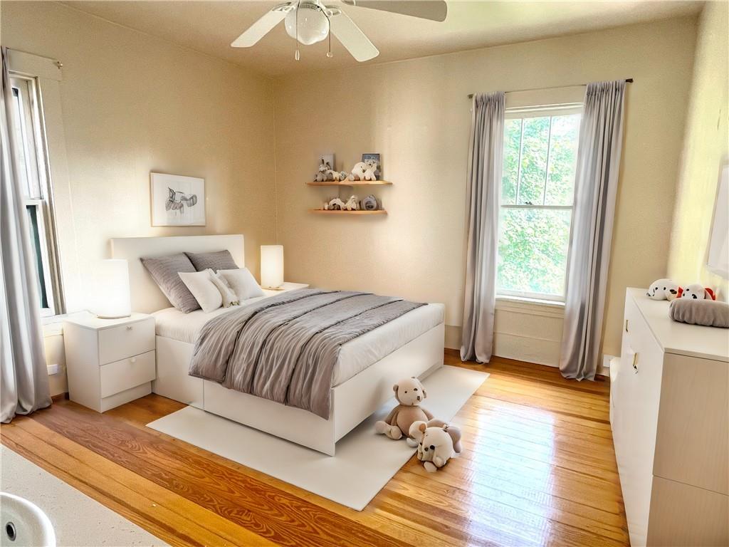 315 Spruce Street Butler, PA 16001 - Photo 23 of 38 a spacious bedroom with a bed and wooden floor