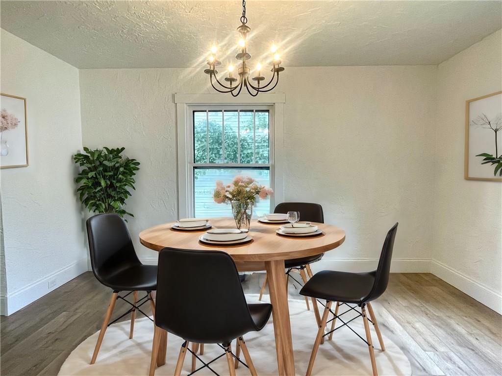 315 Spruce Street Butler, PA 16001 - Photo 10 of 38 a view of a dining room with furniture window and wooden floor
