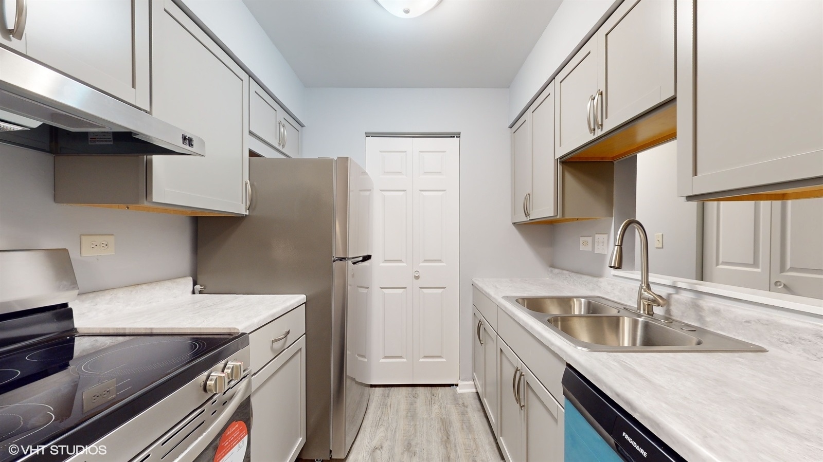 651 South Virginia Road, Unit 326 Crystal Lake, IL 60014 - Photo 11 of 26 a kitchen with a sink stove and cabinets