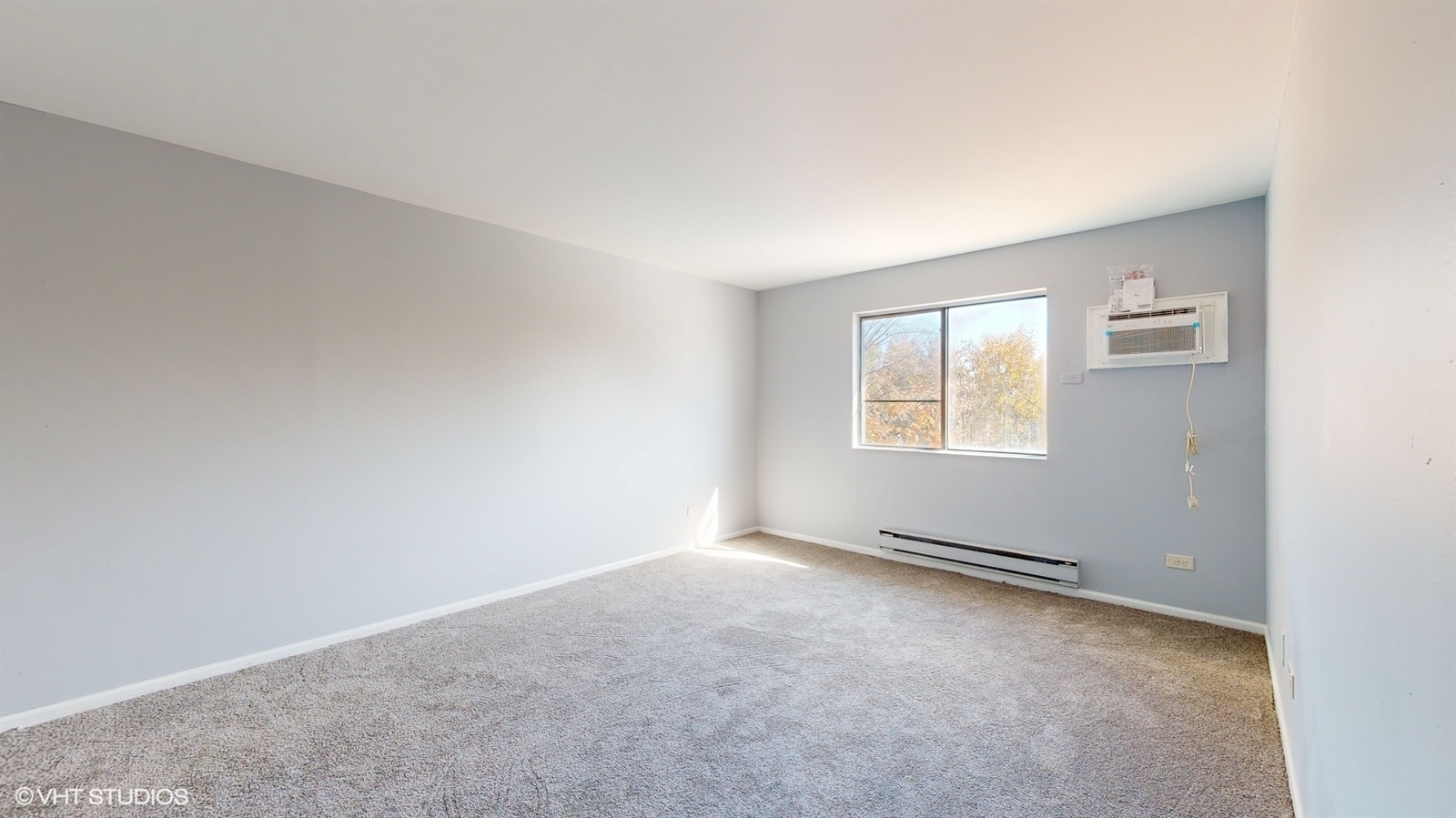 651 South Virginia Road, Unit 326 Crystal Lake, IL 60014 - Photo 13 of 26 an empty room with windows