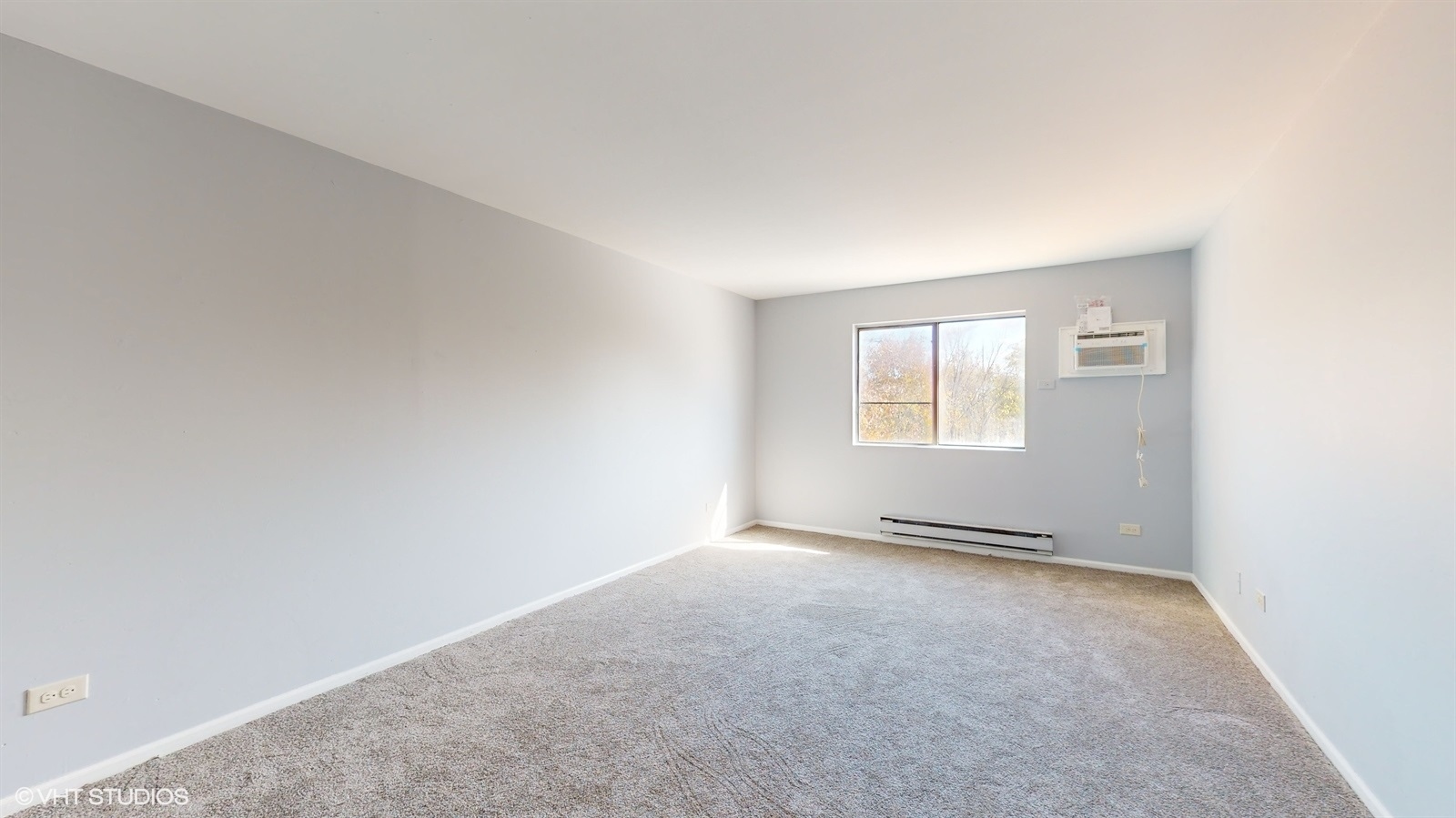 651 South Virginia Road, Unit 326 Crystal Lake, IL 60014 - Photo 17 of 26 an empty room with windows