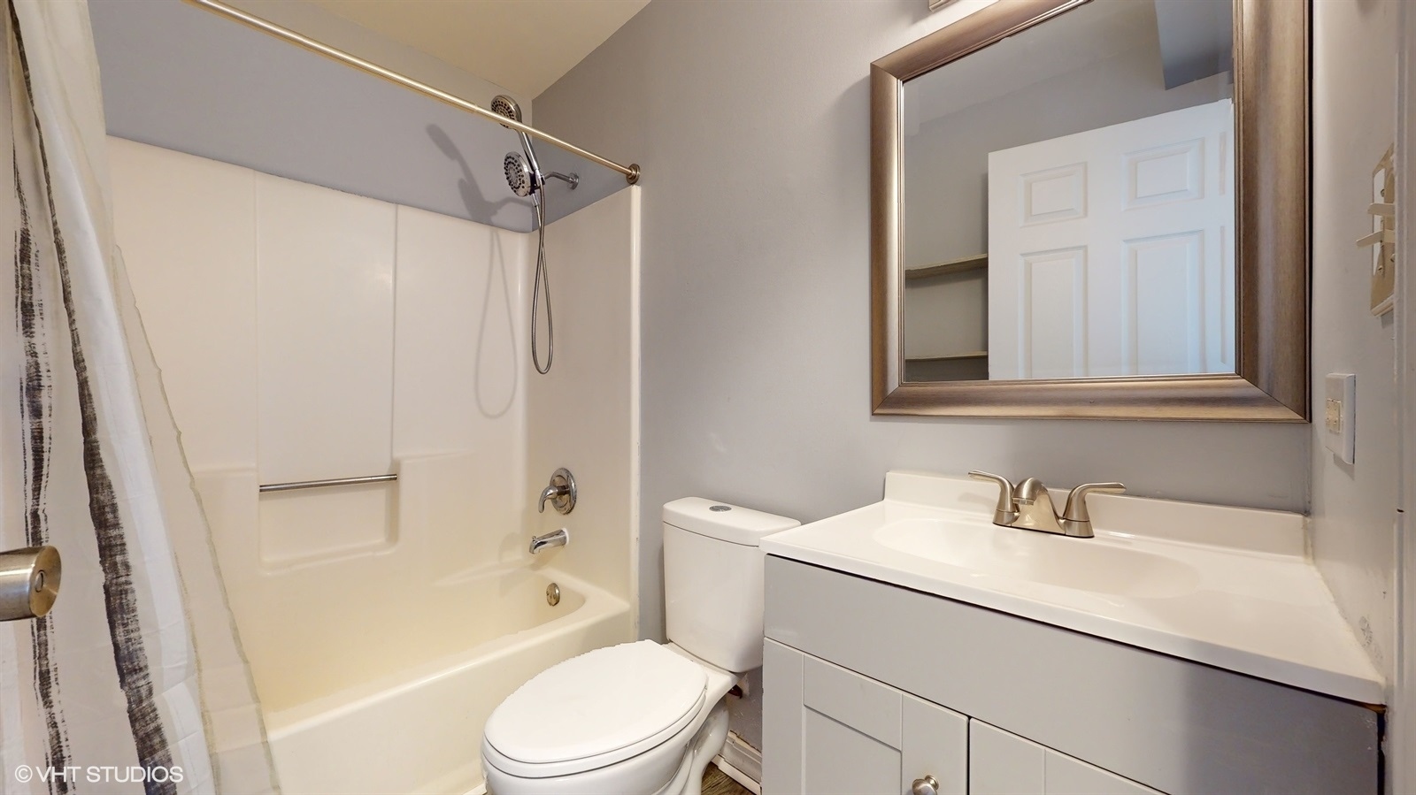 651 South Virginia Road, Unit 326 Crystal Lake, IL 60014 - Photo 23 of 26 a bathroom with a sink toilet and shower