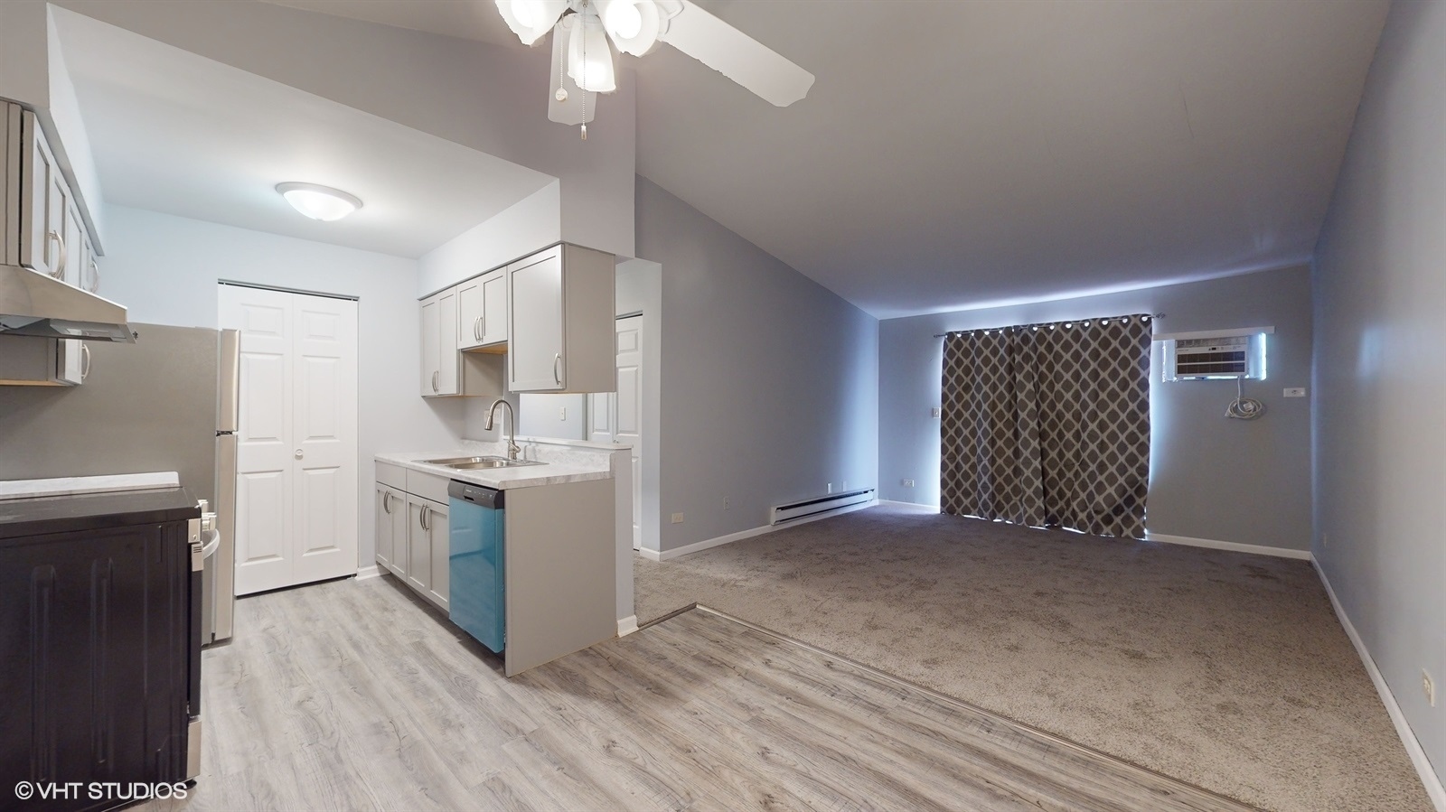 651 South Virginia Road, Unit 326 Crystal Lake, IL 60014 - Photo 6 of 26 a view of a kitchen with a sink and dishwasher a refrigerator with wooden floor