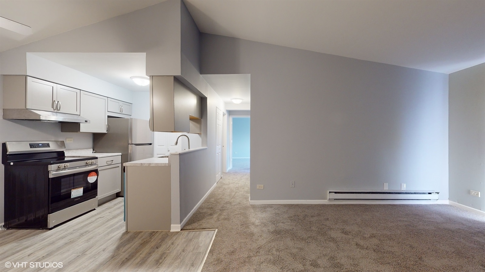 651 South Virginia Road, Unit 326 Crystal Lake, IL 60014 - Photo 8 of 26 a view of a kitchen with cabinets and wooden floor