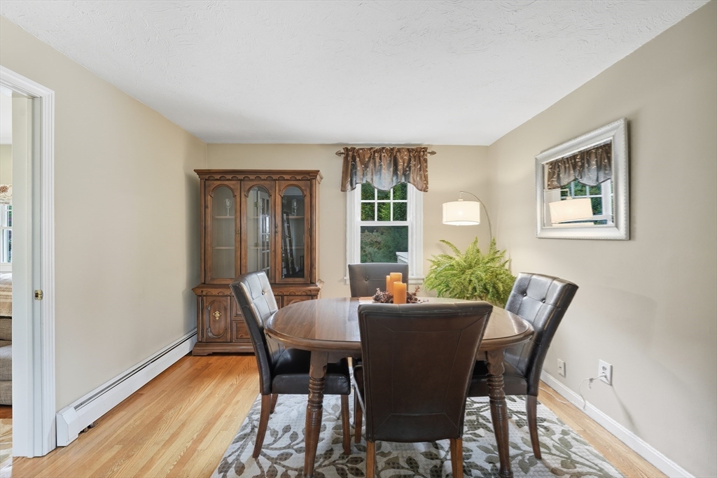 25 Bremen Street Springfield, MA 01108 - Photo 11 of 42 a view of a dining room with furniture and wooden floor