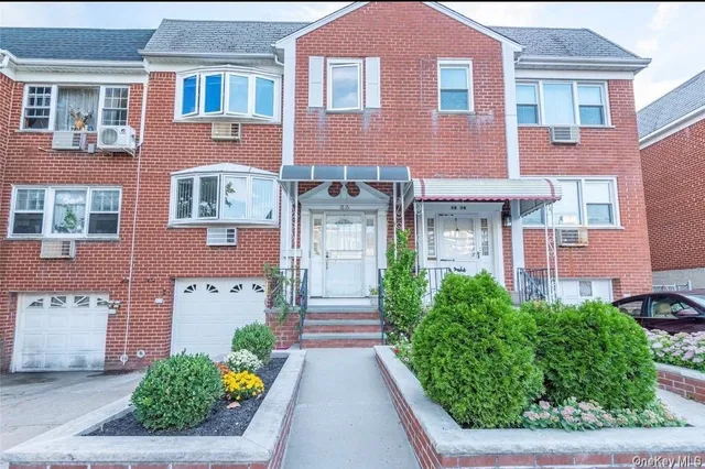 a front view of a building with garden