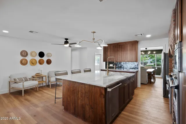 a large kitchen with a large island in the center