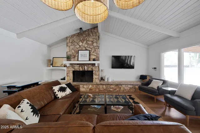 a living room with furniture and a fireplace
