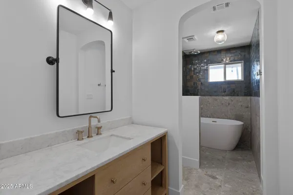 a bathroom with a sink and a mirror