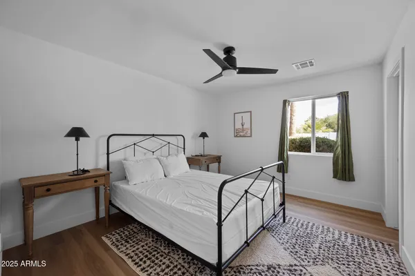 a bedroom with a bed and window