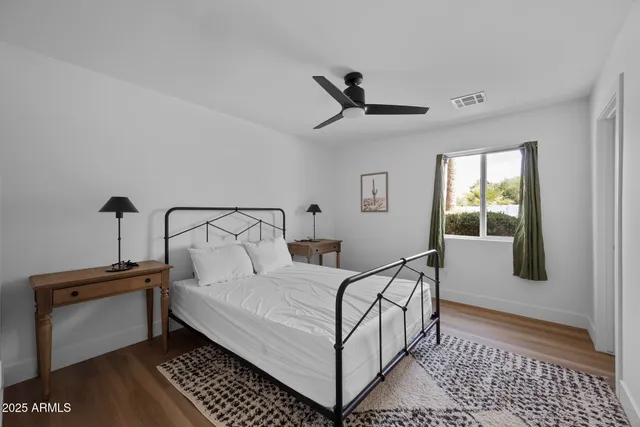 a bedroom with a bed and window