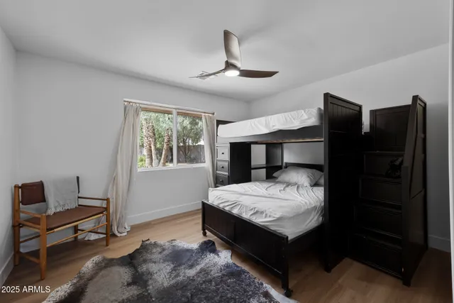 a bedroom with bed and window