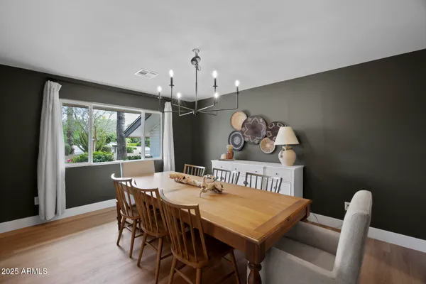 a view of a dining room with furniture window and outside view