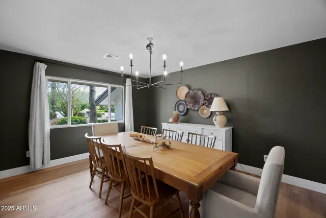 a view of a dining room with furniture window and outside view