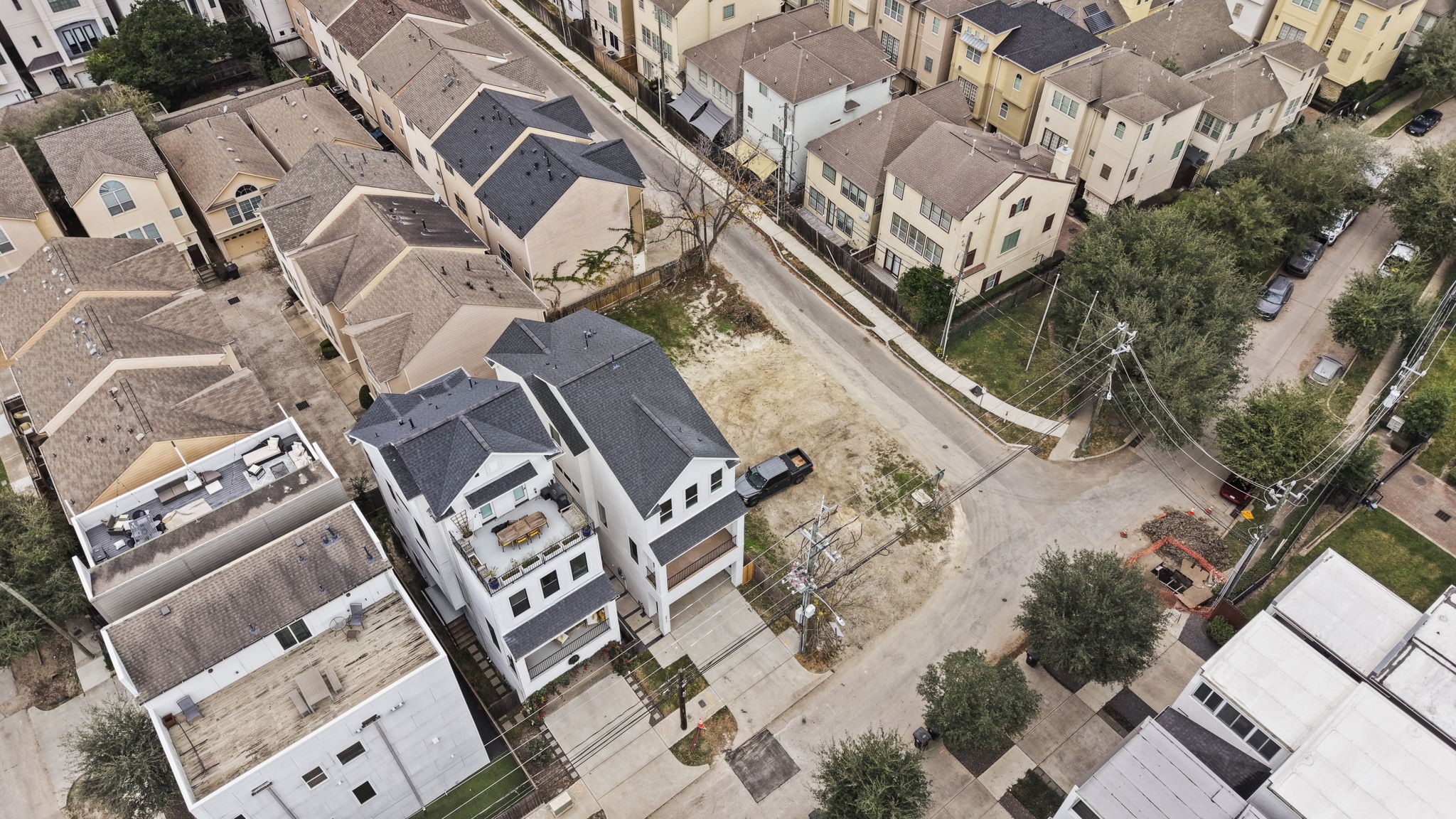 5807 Katy Street Houston, TX 77007 - Photo 23 of 37 This wide-angle aerial perfectly captures the property's central location. Surrounded by a sea of modern rooftops and lush green pockets, it offers the perfect balance of city energy and residential prestige.
