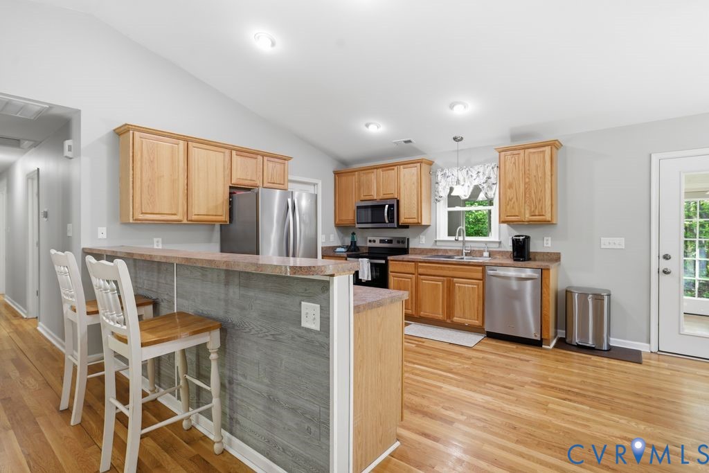 5307 St Pauls Church Road Goochland, VA 23063 - Photo 13 of 44 a kitchen with granite countertop stainless steel appliances cabinets a sink and a counter top space