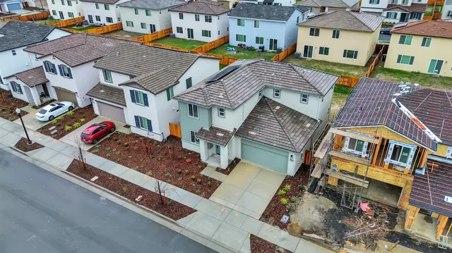 a view of a backyard of the house