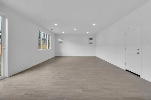 a view of empty room with windows