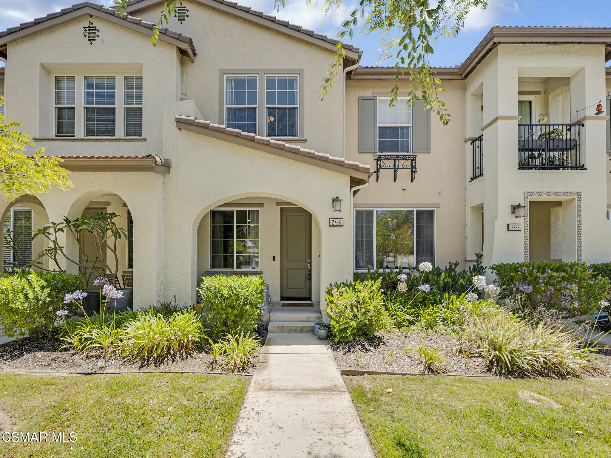front view of a house with a garden