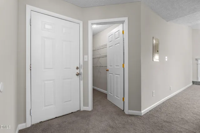 an empty room with a empty space and a window