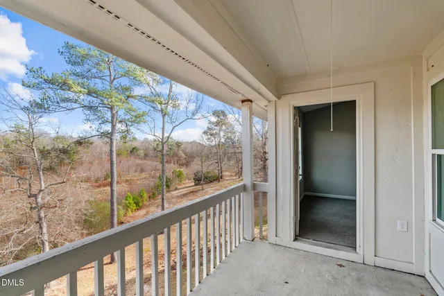 a view of a glass door with a balcony