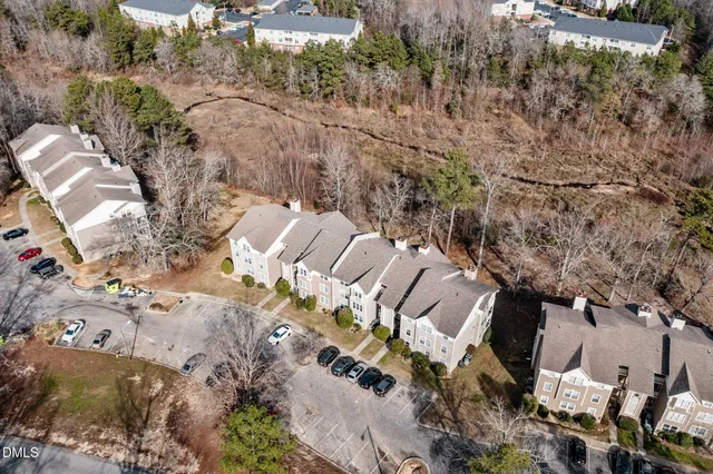 a aerial view of a house with garden space and sitting area