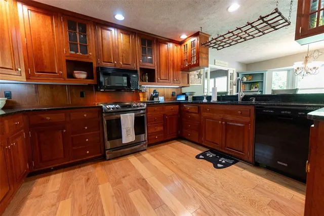 a living room with hard wood floors and a window