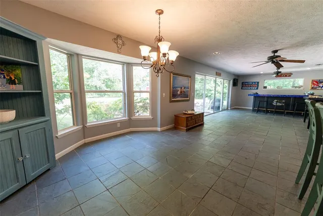 a view of a hallway with wooden floor and closet