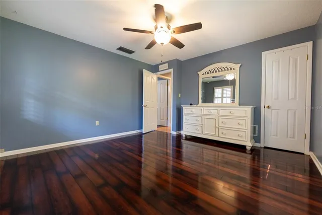 a view of a house with backyard sitting area and garden