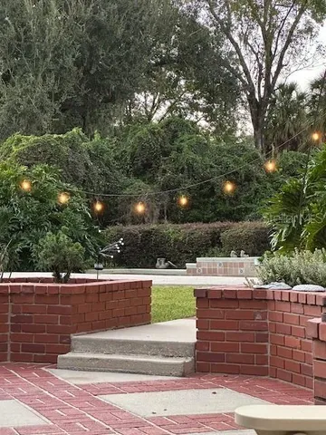 a view of backyard of house with green space