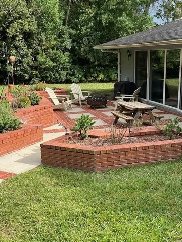 a view of swimming pool with a yard