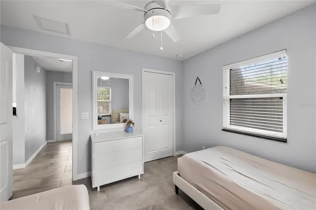 a room with a bed and a chandelier