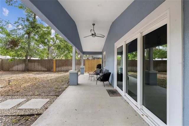 a view of a porch with chairs and floor