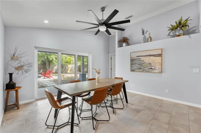 a dining room with furniture and window